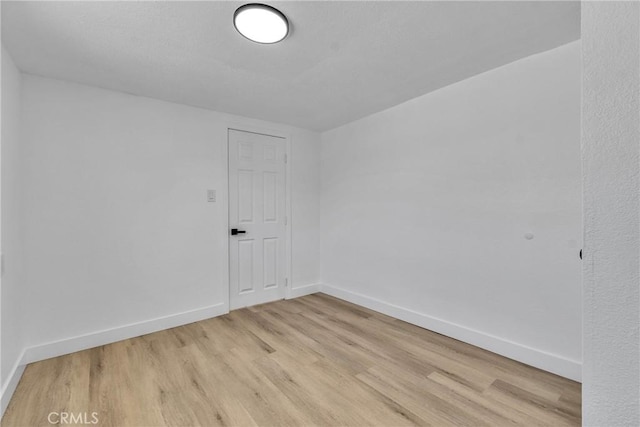 26339 First St, Loma Linda, CA 92318 - spare room featuring baseboards and light wood-style flooring