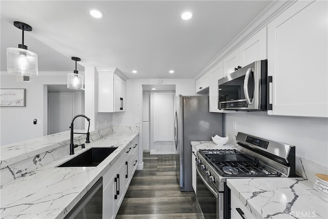 kitchen with dark wood-style floors, recessed lighting, white cabinetry, a sink, and appliances with stainless steel finishes