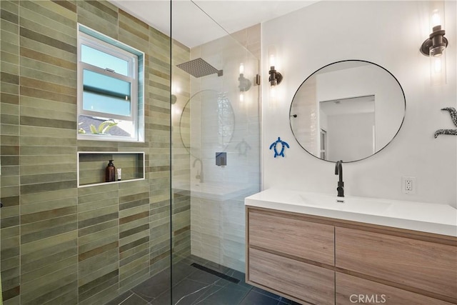 bathroom with vanity, tile patterned flooring, and walk in shower