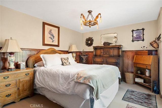 256 B Ln, Lake Arrowhead, CA 92352 - bedroom featuring a chandelier, a wainscoted wall, and light colored carpet