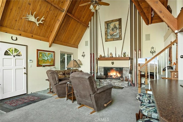 256 B Ln, Lake Arrowhead, CA 92352 - living room featuring a wood ceiling with exposed beams, carpet, a stone fireplace, ceiling fan, and high vaulted ceiling