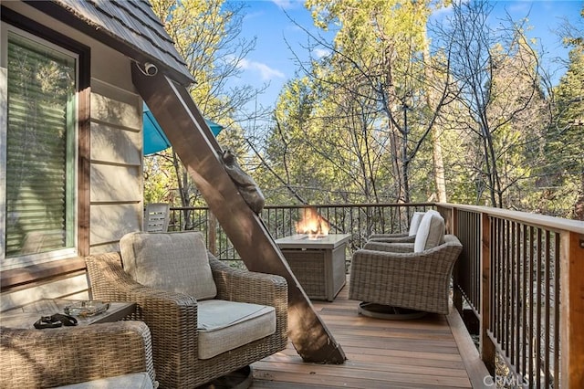 256 B Ln, Lake Arrowhead, CA 92352 - wooden deck featuring an outdoor fire pit