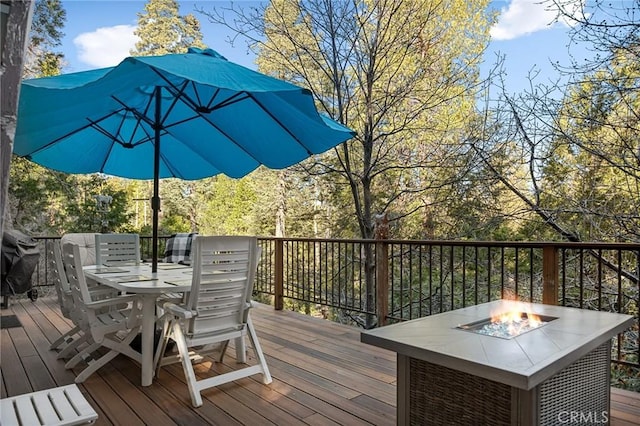 256 B Ln, Lake Arrowhead, CA 92352 - wooden deck with an outdoor fire pit and outdoor dining area