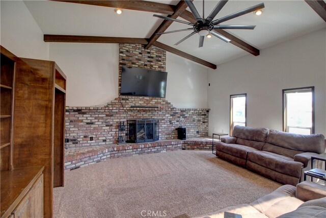 unfurnished living room with high vaulted ceiling, beam ceiling, carpet floors, a ceiling fan, and a brick fireplace