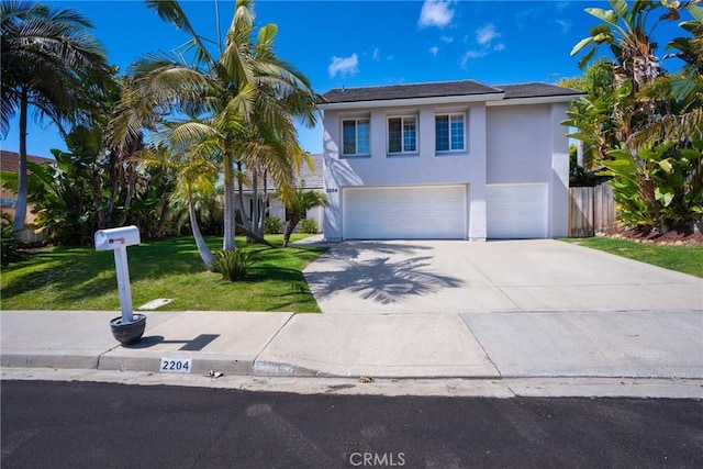 2204 Recodo Ct, Carlsbad, CA 92009 - view of front of property featuring stucco siding, a garage, concrete driveway, and a front lawn
