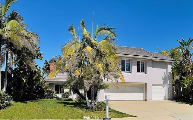 2204 Recodo Ct, Carlsbad, CA 92009 - view of front of property with stucco siding, driveway, a garage, and a front lawn