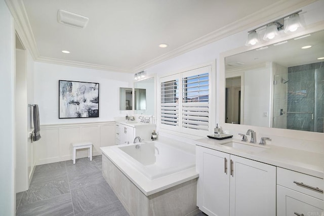 bathroom with a bath, visible vents, crown molding, a shower stall, and a sink