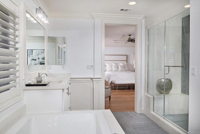 full bathroom featuring visible vents, vanity, ensuite bathroom, ceiling fan, and a stall shower