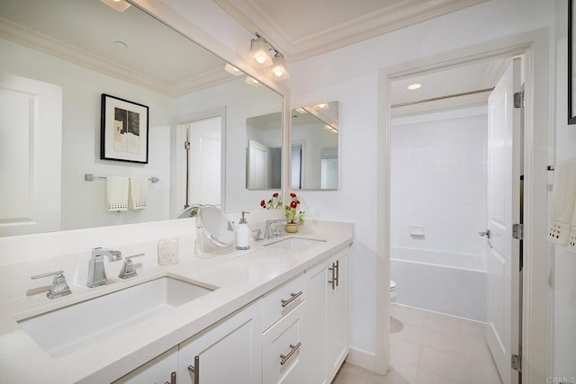 bathroom with crown molding, a sink, and toilet