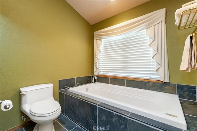 15516 Valley View Dr, Weed, CA 96094 - full bathroom with toilet, a textured wall, lofted ceiling, and a bath