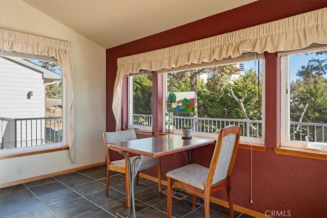 15516 Valley View Dr, Weed, CA 96094 - dining room with stone tile flooring, baseboards, and lofted ceiling