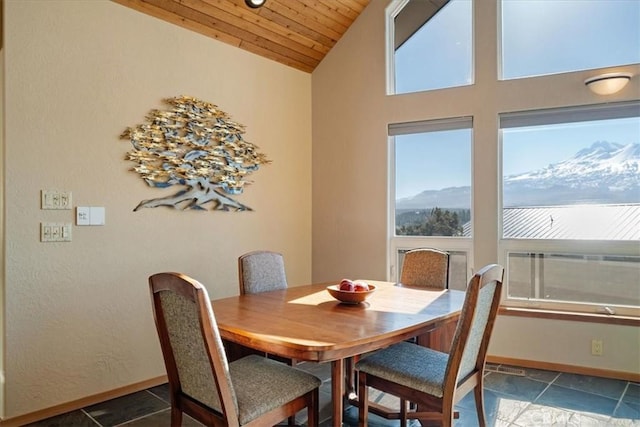 15516 Valley View Dr, Weed, CA 96094 - dining room with baseboards, a mountain view, vaulted ceiling, and wooden ceiling