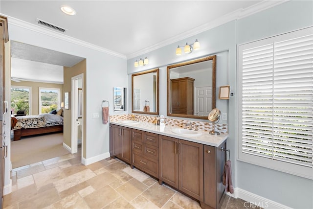 2 Williamsburg Ln, Coto De Caza, CA 92679 - ensuite bathroom with baseboards, ensuite bathroom, backsplash, visible vents, and a sink