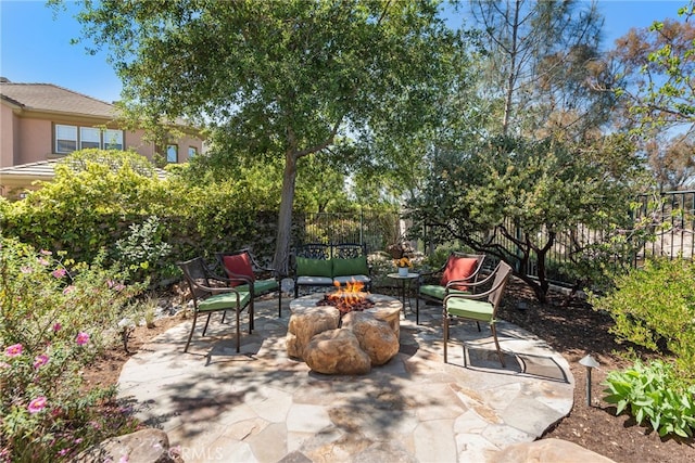 2 Williamsburg Ln, Coto De Caza, CA 92679 - view of patio with a fenced backyard and an outdoor fire pit