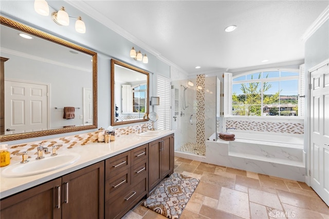 2 Williamsburg Ln, Coto De Caza, CA 92679 - bathroom with double vanity, ornamental molding, stone tile flooring, a shower stall, and a sink