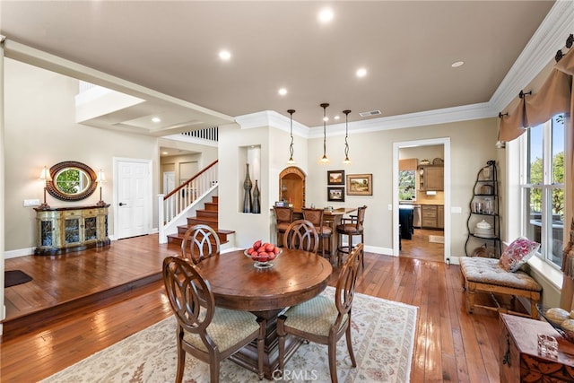 2 Williamsburg Ln, Coto De Caza, CA 92679 - dining room with baseboards, wood-type flooring, visible vents, and stairway