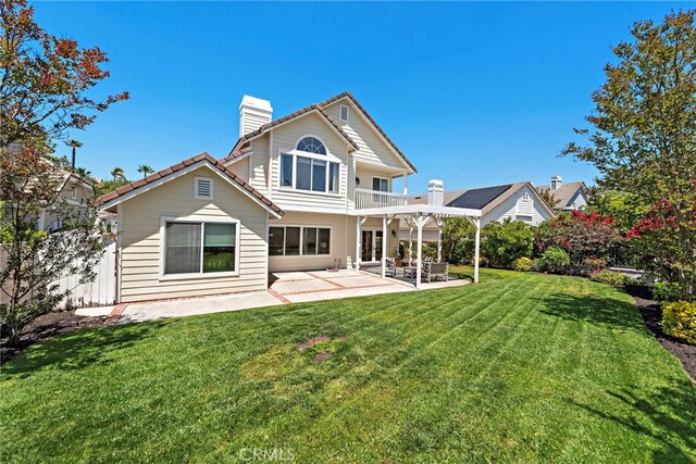 10 Cambridge Ct, Coto De Caza, CA 92679 - back of house with a chimney, a balcony, a patio area, a lawn, and a pergola