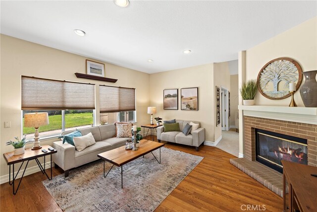 10 Cambridge Ct, Coto De Caza, CA 92679 - living area with a brick fireplace, baseboards, wood finished floors, and recessed lighting