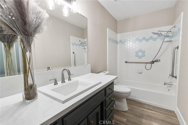 5703 Violet Ct, Atwater, CA 95301 - bathroom with toilet, vanity, wood finished floors, and tub / shower combination