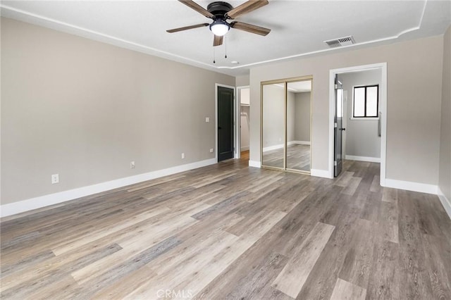 5703 Violet Ct, Atwater, CA 95301 - unfurnished bedroom featuring baseboards, wood finished floors, a closet, and ceiling fan