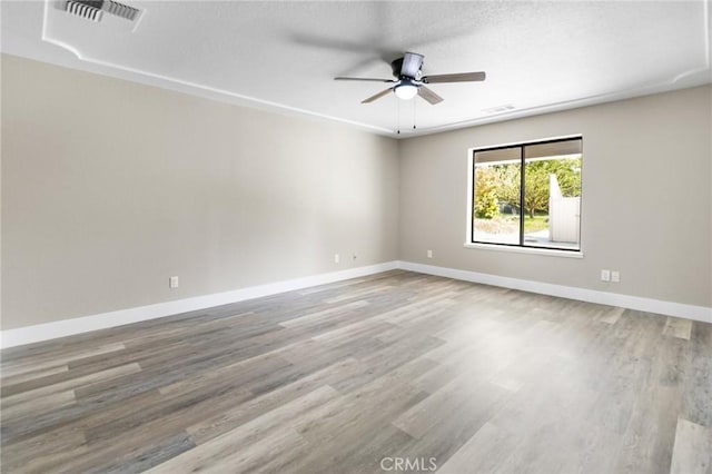 5703 Violet Ct, Atwater, CA 95301 - spare room with ceiling fan, wood finished floors, and baseboards