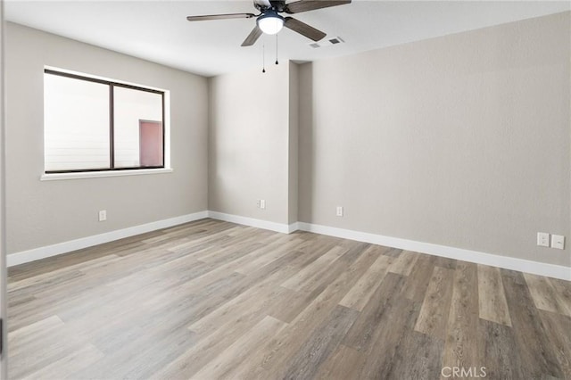 5703 Violet Ct, Atwater, CA 95301 - empty room with ceiling fan, wood finished floors, and baseboards