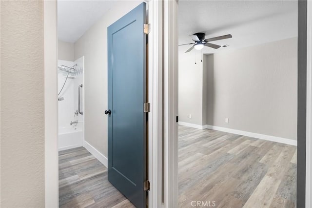 5703 Violet Ct, Atwater, CA 95301 - corridor featuring wood finished floors and baseboards