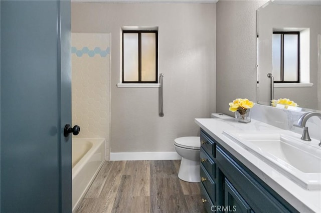 5703 Violet Ct, Atwater, CA 95301 - bathroom featuring wood finished floors, vanity, toilet, and baseboards