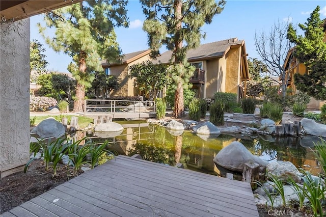 exterior space featuring a small pond