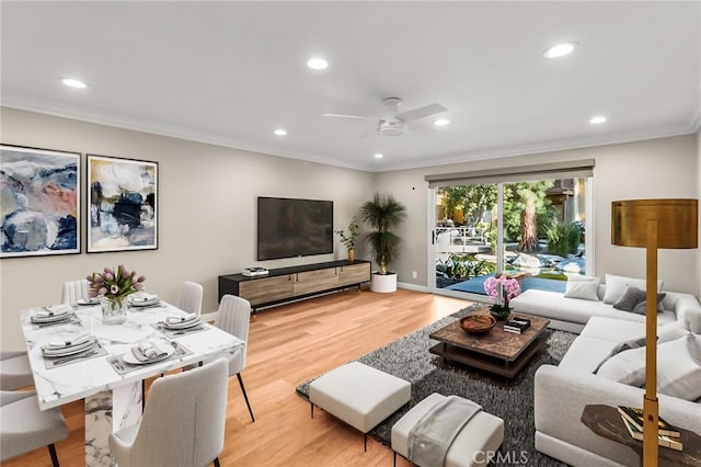 living room with wood finished floors, ceiling fan, baseboards, ornamental molding, and recessed lighting