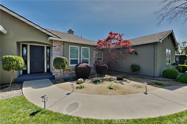 2100 Sherwood Ave Unit A, Modesto, CA 95350 - view of front of home featuring stucco siding and a chimney