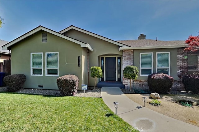 2100 Sherwood Ave Unit A, Modesto, CA 95350 - view of front of property featuring a chimney, crawl space, brick siding, a front lawn, and stucco siding