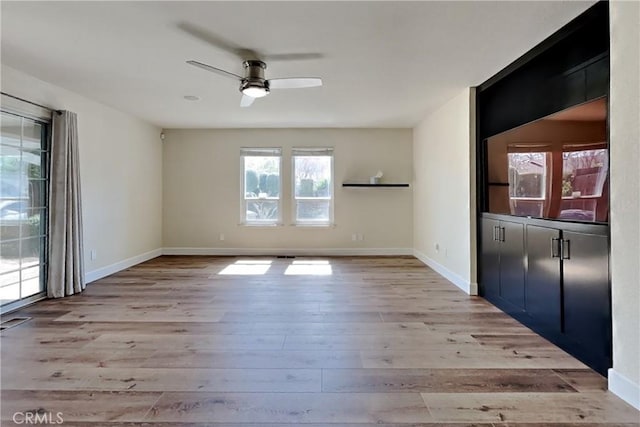 2100 Sherwood Ave Unit A, Modesto, CA 95350 - interior space featuring a ceiling fan, baseboards, light wood finished floors, and visible vents