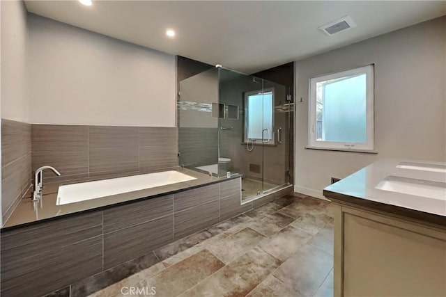 2100 Sherwood Ave Unit A, Modesto, CA 95350 - bathroom featuring visible vents, a shower stall, double vanity, recessed lighting, and a garden tub