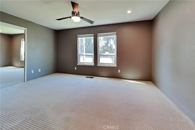 2100 Sherwood Ave Unit A, Modesto, CA 95350 - carpeted spare room with baseboards, visible vents, ceiling fan, and recessed lighting