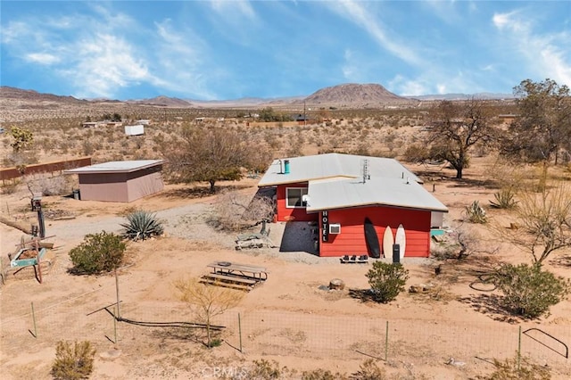 exterior space with a mountain view, a desert view, and a rural view