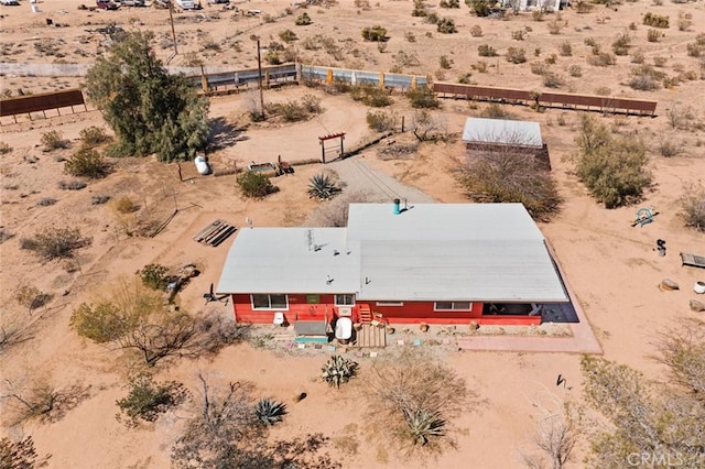 birds eye view of property featuring a desert view and a rural view