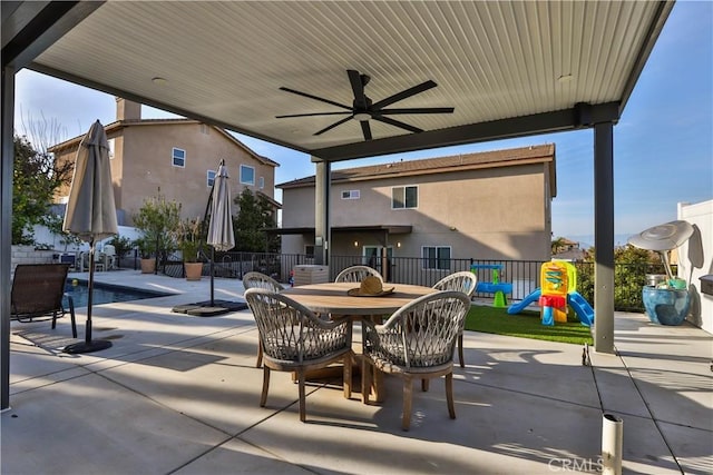 13083 Via Tuscany, Riverside, CA 92503 - view of patio featuring outdoor dining area, a ceiling fan, and a playground