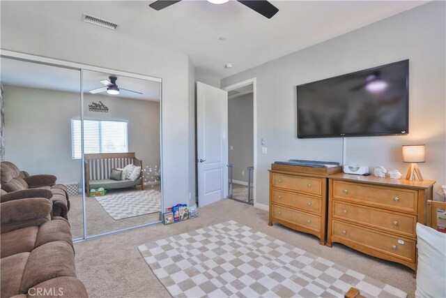 13083 Via Tuscany, Riverside, CA 92503 - bedroom featuring light colored carpet, a closet, and a ceiling fan