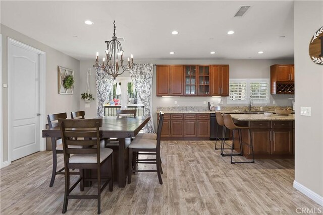 13083 Via Tuscany, Riverside, CA 92503 - dining space with recessed lighting, light wood-style floors, a chandelier, and baseboards
