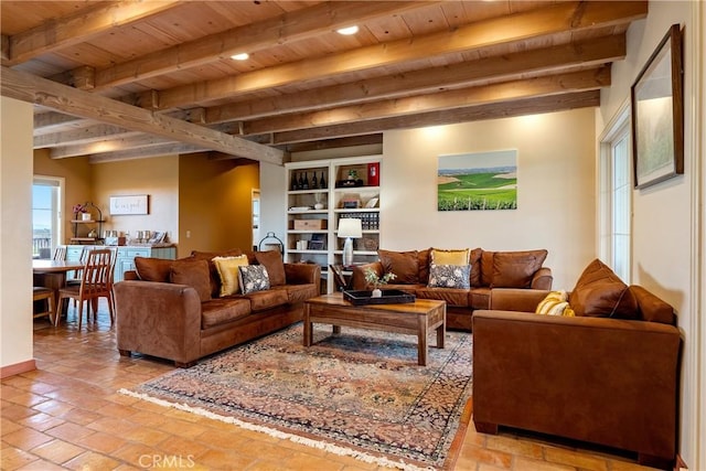 living area with wooden ceiling and beam ceiling