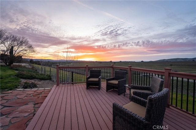 wooden deck featuring a mountain view and a rural view