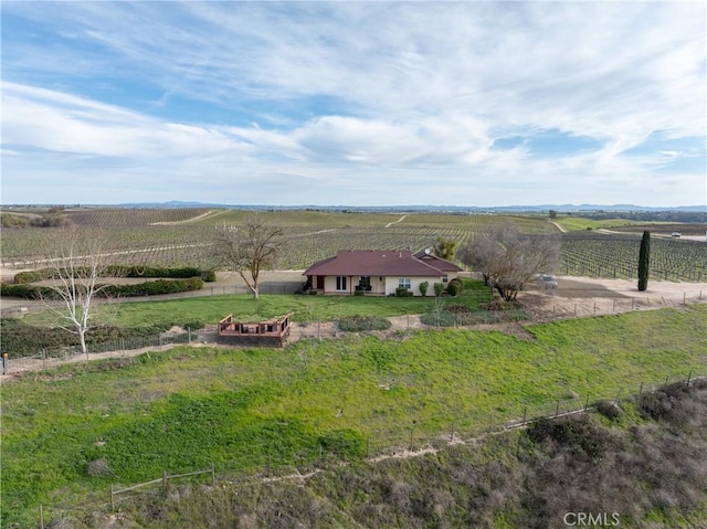 birds eye view of property with a rural view