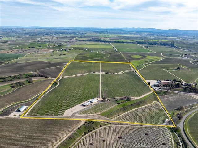 birds eye view of property with a rural view