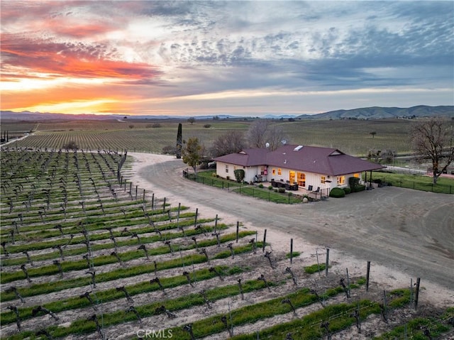 drone / aerial view featuring a mountain view and a rural view