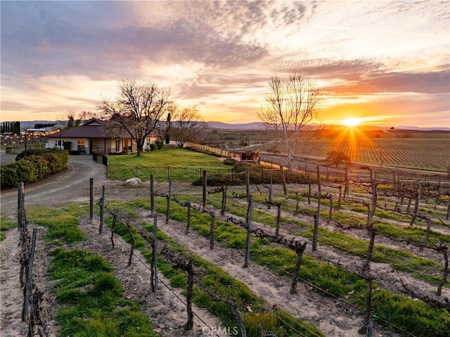 exterior space featuring fence and a rural view