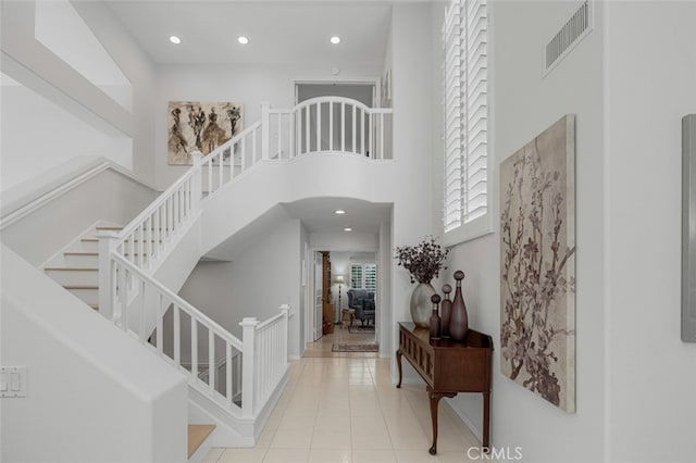 25382 Village Rd, Dana Point, CA 92629 - tiled foyer entrance with stairway, a towering ceiling, and recessed lighting