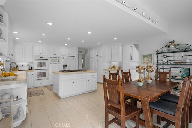 25382 Village Rd, Dana Point, CA 92629 - dining room with light tile patterned floors and recessed lighting