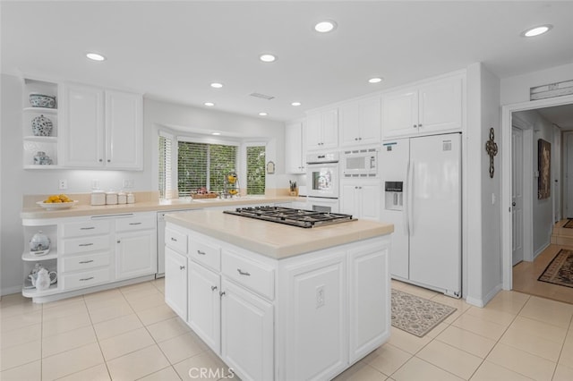 25382 Village Rd, Dana Point, CA 92629 - kitchen with white appliances, open shelves, light countertops, white cabinets, and recessed lighting