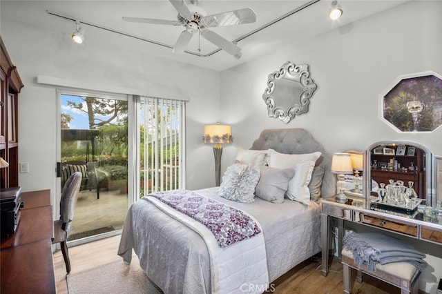 25382 Village Rd, Dana Point, CA 92629 - bedroom with access to exterior, wood finished floors, rail lighting, and ceiling fan